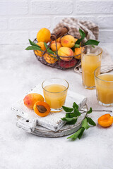 Apricot juice in glass. Healthy drink