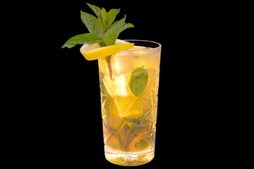 Fresh peach lemonade with ice cubes in a glass,
