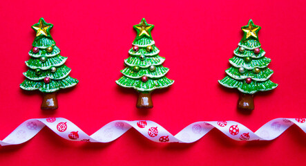 top view Christmas trees on red background. Free copy space. Concept of decoration, greeting cards. web banner