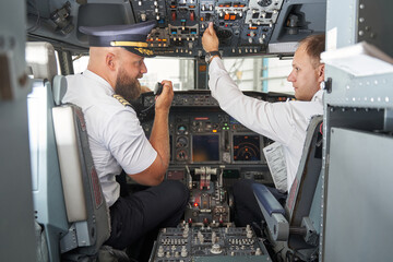 Modern cockpit of the passenger aircraft in the hangar