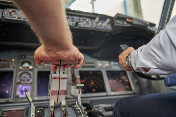 Fototapeta na wymiar Experienced pilots accelerating the engine at the flight