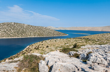 Fototapeta na wymiar Strait between the mountainous islands of the Kornati archipelago in the Adriatic sea