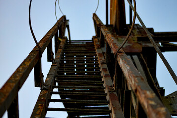 Stairs on an olden rusty bridge