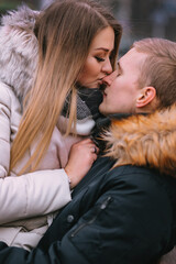 Two lovers are hugging and kissing in Saint Valentine's Day.