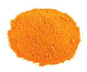 Close up of heap of tumeric powder against a white background