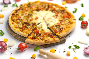 Delicious pizza with tomato, mushrooms, processed cheese on wooden plate