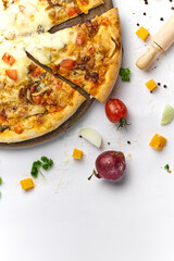 Delicious pizza with tomato, mushrooms, processed cheese on wooden plate