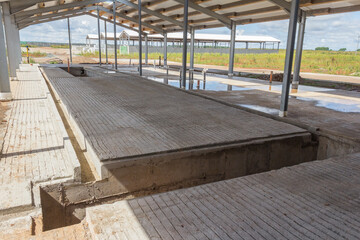 Concrete floor with building under construction. Concrete base of the floor. Construction of the...