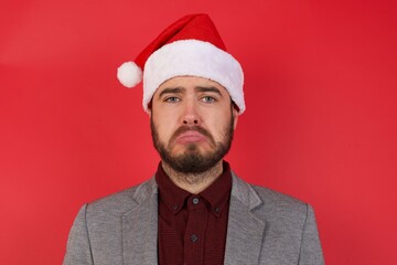 Portrait of displeased upset Young caucasian businessman wearing casual clothes standing over...