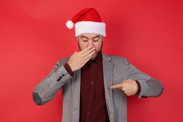Shocked Young caucasian businessman wearing casual clothes standing  look surprisedly down,...