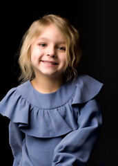 Close Up View of Cute Smiling Blonde Girl Posing on Black Background.