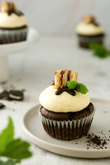 Chocolate cupcake with vanilla butter cream. Sweet dessert.