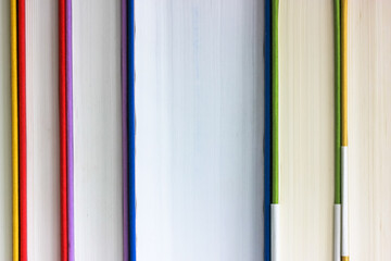 Bookshelf: colorful books in hardcover, various literature