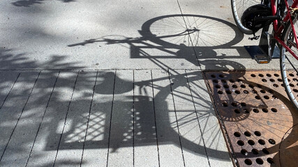 Bike shadow on sidewalk