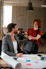 Businessman and businesswoman in office. Businesswoman and businessman working on the project..