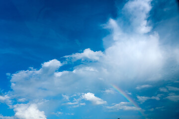 Fototapeta na wymiar Rainbow in the sky in rainy season in Chiangmai , Thailand