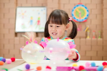 young  girl  making craft for homeschooling