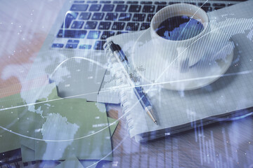 Double exposure of forex chart drawing and desktop with coffee and items on table background. Concept of financial market trading