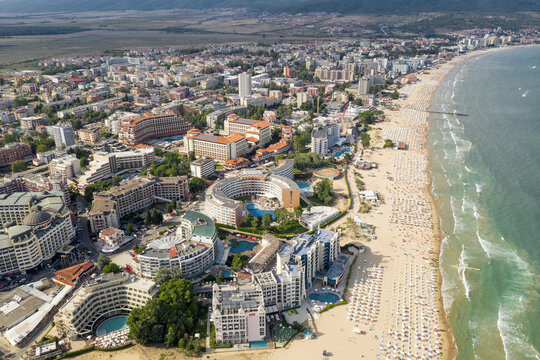 Suny Beach, Bulgaria - August 09, 2019: Aerial image a drone resort in Bulgaria on Black Sea coast. Many hotels and beaches with tourists, sunbeds and umbrellas. Sea travel destination. Travel
