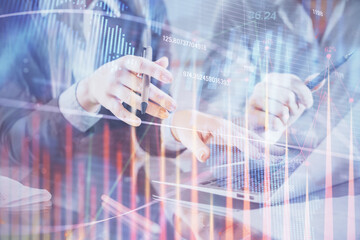 Multi exposure of man and woman working together and financial chart hologram. Business concept. Computer background.