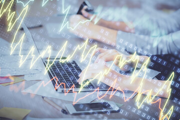 Multi exposure of woman hands typing on computer and financial chart hologram drawing. Stock market analysis concept.