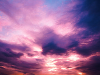 Obraz premium Fiery sunset sky. Beautiful sky. Evening sky with colorful cloud on twilight, Dusk. Background Sunset / sunrise with clouds, light rays and other atmospheric effect