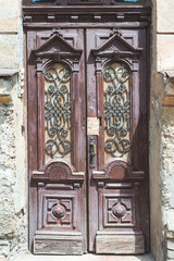 Fototapeta na wymiar Antique wooden doors in an old town house