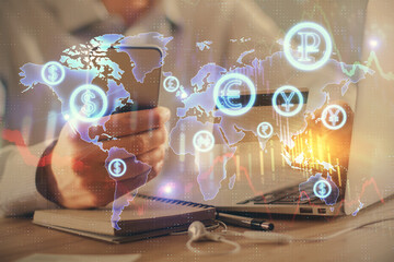 Double exposure of man hands holding a credit card and Forex graph drawing. Stock trading and digital fintech in Internet E-commerce concept.