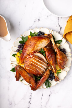 Carved Roasted Turkey For The Calebration Thanksgiving Or Christmas Dinner On A Plate Overhead Shot