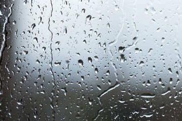 Abstract background, selective focus. Raindrops on glass. Spray on the window. Rainy weather