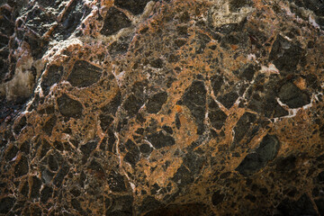 Colorful rock texture. Natural cracks void.