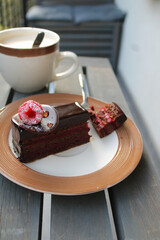 cake slice and a cup of cappuccino coffee.