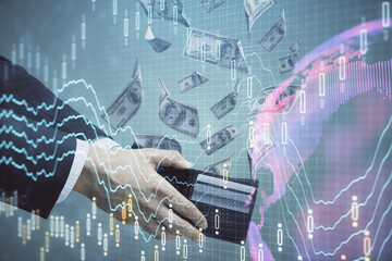 Multi exposure of financial graph drawing hologram and USA dollars bills and man hands. Analysis concept.