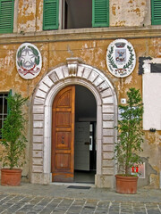 Fototapeta na wymiar Italy, Marche, Morro d’Alba the town hall door.