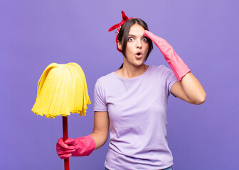 young pretty woman looking happy, astonished and surprised, smiling and realizing amazing and...