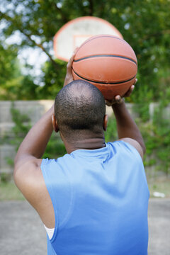 Man shooting basketball