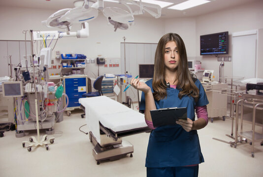 Overworked nurse holding clipboard in hospital room