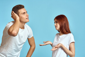 Young woman and man stinks relationship on blue background cropped view of couple in love