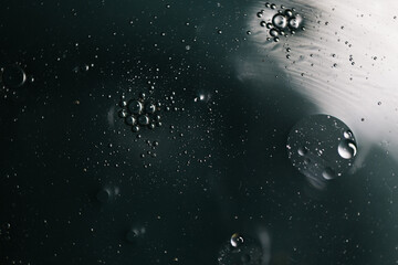 Abstract molecule sctructure. water drops on glass. background with particles. water drops on the window