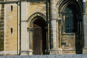 View of the exterior facade of the Basilica of Saint-Remi, a medieval abbey church in Reims, a historical monument in the Grand Est region of France  
