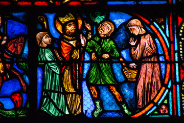 View of stained glass windows inside the Basilica of Saint-Remi, a medieval abbey church in Reims,...