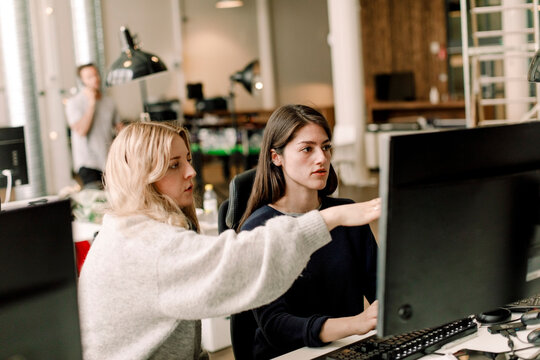Female entrepreneurs discussing at workplace