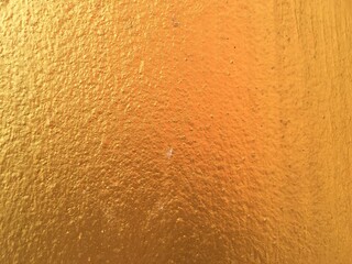 Golden concrete wall texture background 