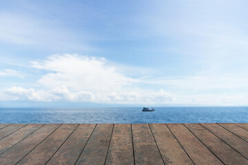 Wooden table top, Beauty seascape under blue clouds sky, blue sea background.