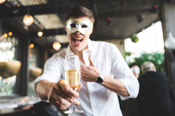 Cheers! Group of people cheering with champagne flutes in pub interior background