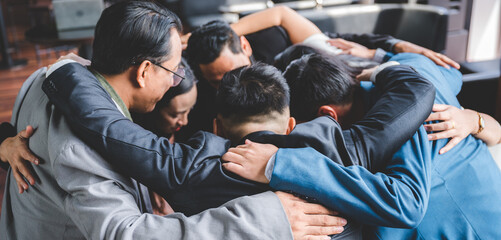 Fototapeta premium Large business team showing unity with their hands together, business success concept.
