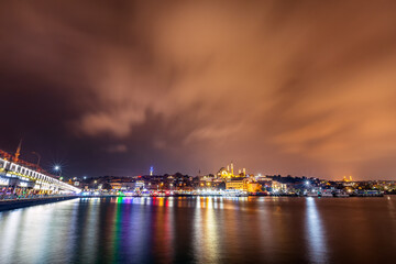 Fototapeta na wymiar Night view of Bosphorus (Turkish: Istanbul Bogazi). The Bosporus or Bosphorus also known as the Strait of Istanbul. It is a narrow, natural strait and an internationally significant waterway located.