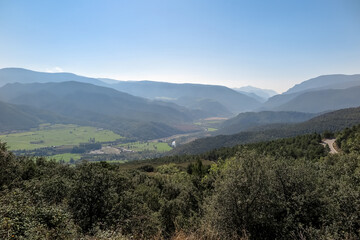 Fototapeta na wymiar General view of valley with several mountains and forests, municipality of La Seu d'Urgell, in the region of Alt Urgell, Spain