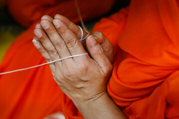 hand of monk during ceremony in buddhist temple - obrazy, fototapety, plakaty