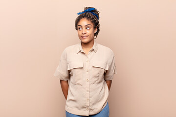young afro woman looking worried, stressed, anxious and scared, panicking and clenching teeth